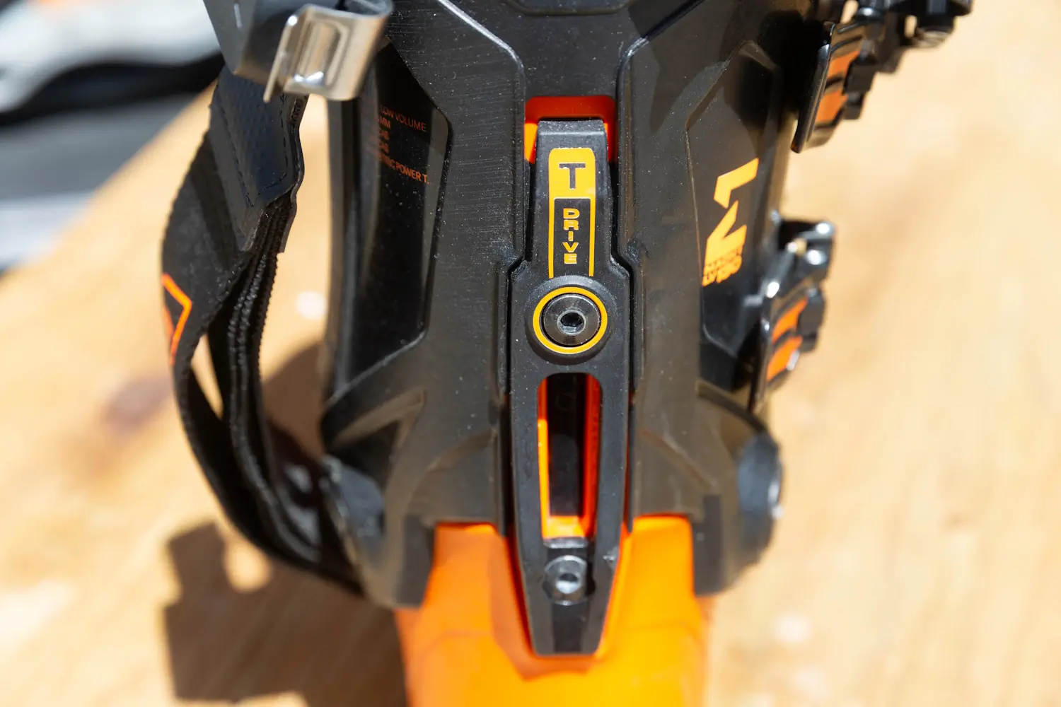Close-up of the rear T-Drive spine on the Tecnica Mach 1 Men’s LV 130 ski boot showing the walk/ski mechanism and power spine