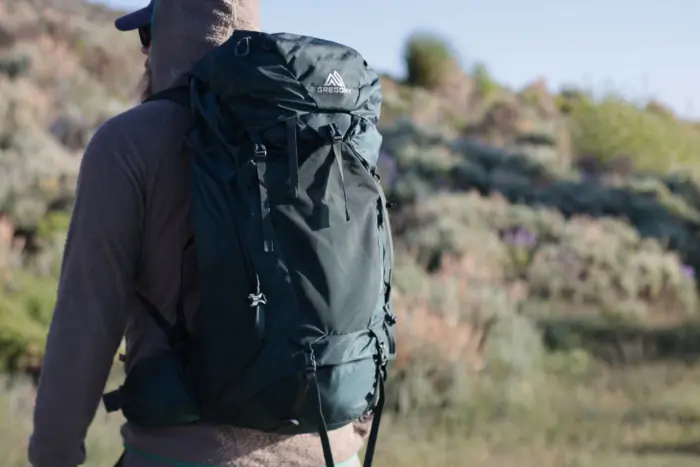 a man wearing Gregory Paragon Pack