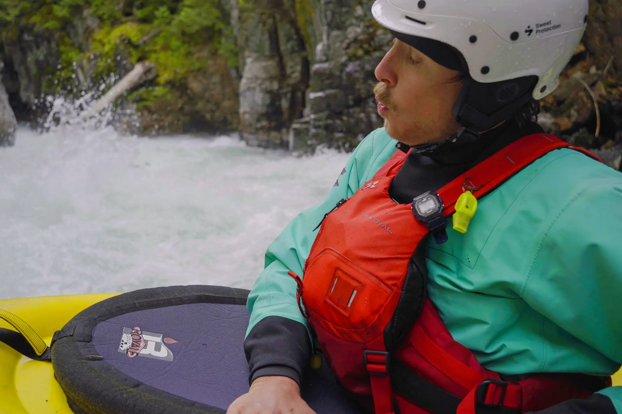 a paddler wearing the astral indus steadies himself before heading downstream into the tumwater canyon