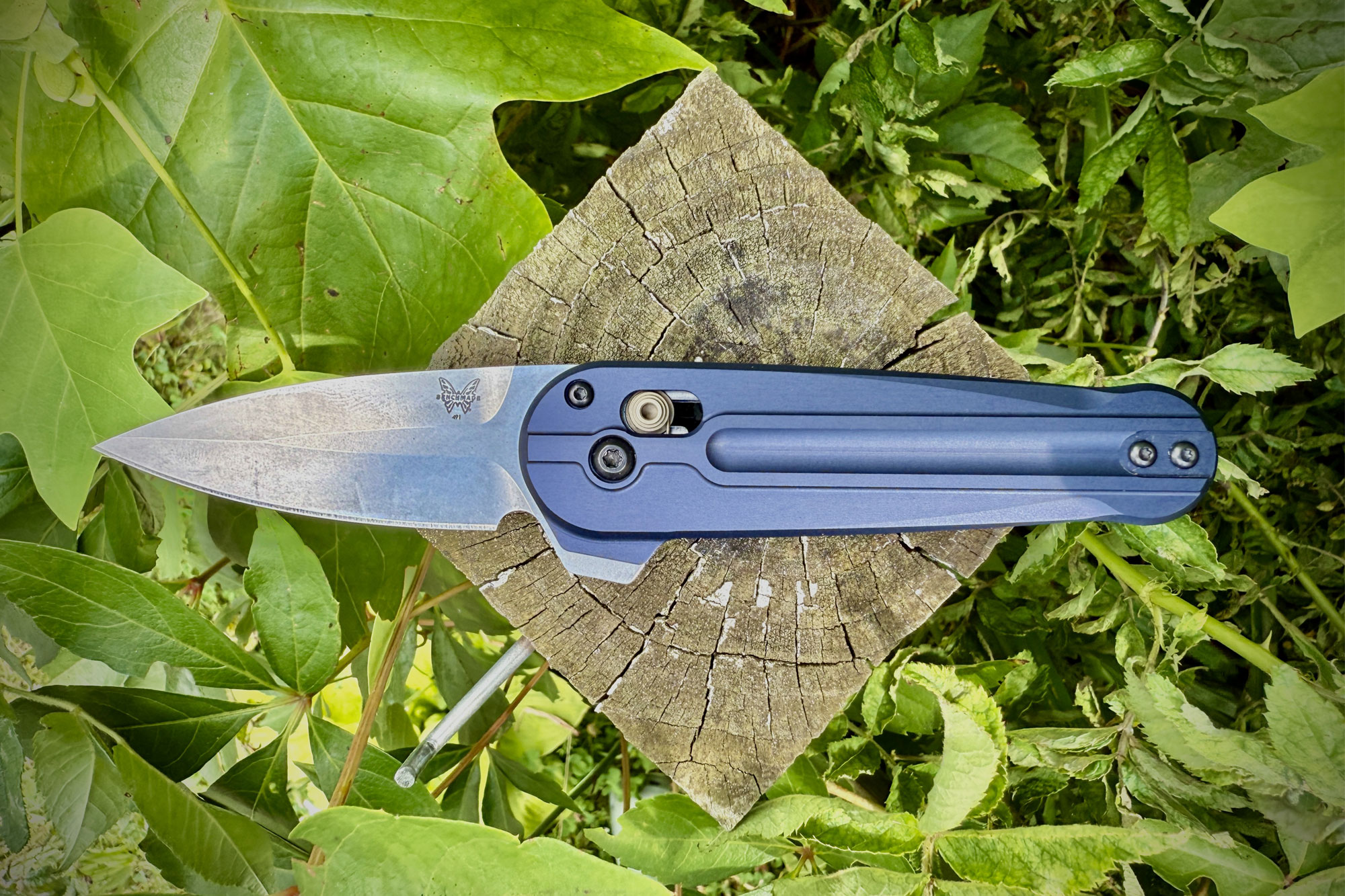 Benchmade Lowden knife on a wooden stump