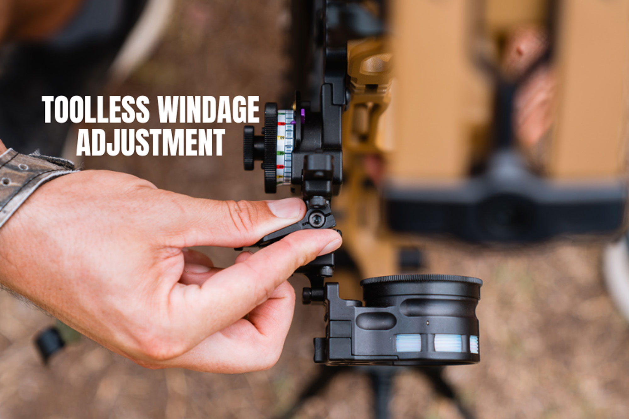 Close-up of a person adjusting a compound bow sight