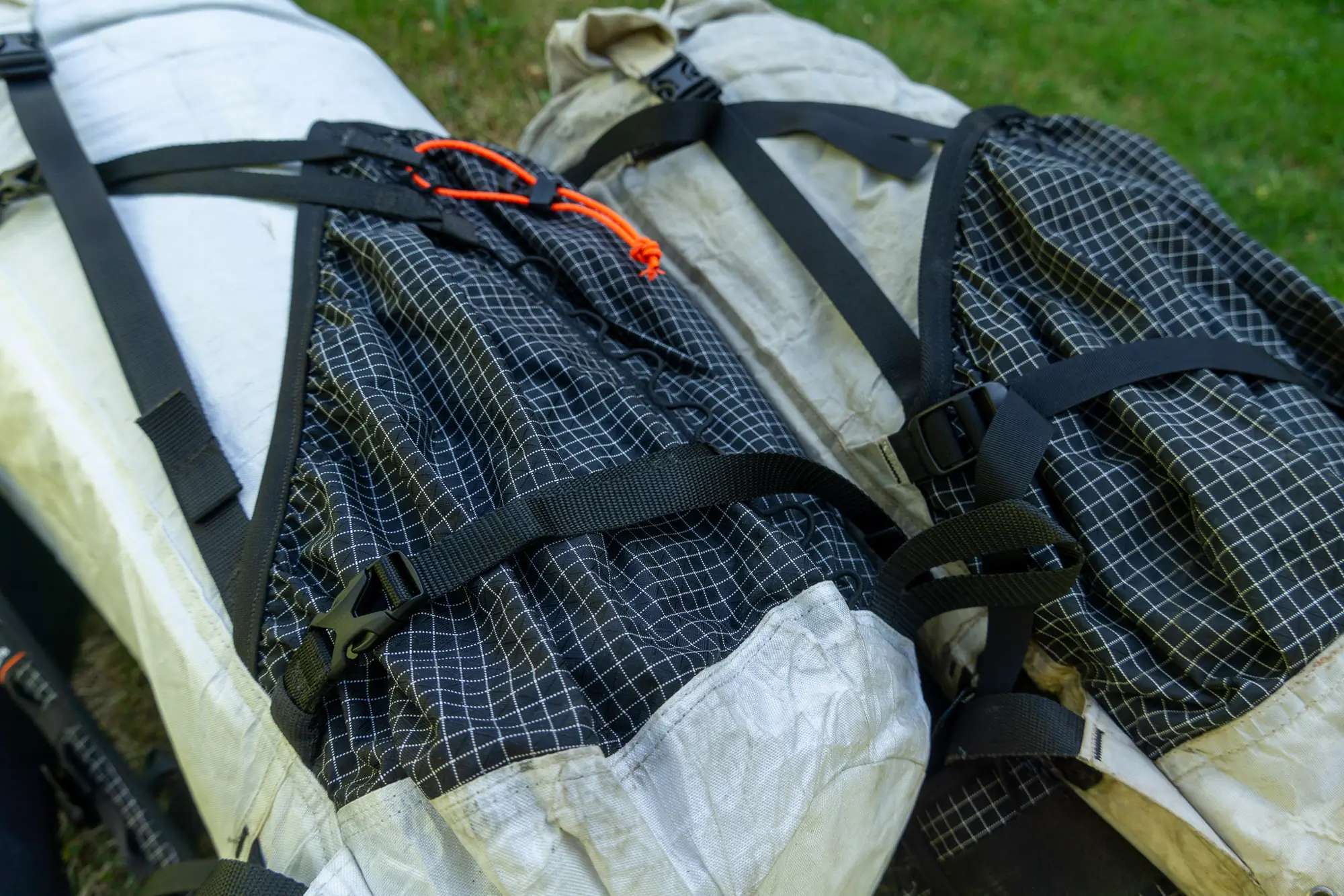two hmg southwest packs side by side, showing the differences in strap and pocket arrangements