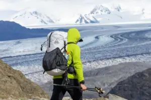 a backpacker wearing the hyperlite mountain gear southwest pack traverses in front of the patagonian icefield