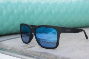 The Goodr Tidal G sunglasses next to a pool