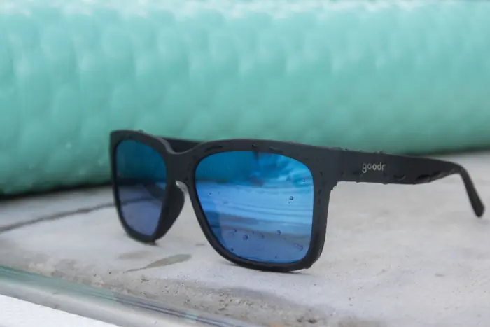 The Goodr Tidal G sunglasses next to a pool