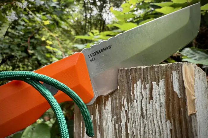 Leatherman Pioneer knife stuck in wooden post