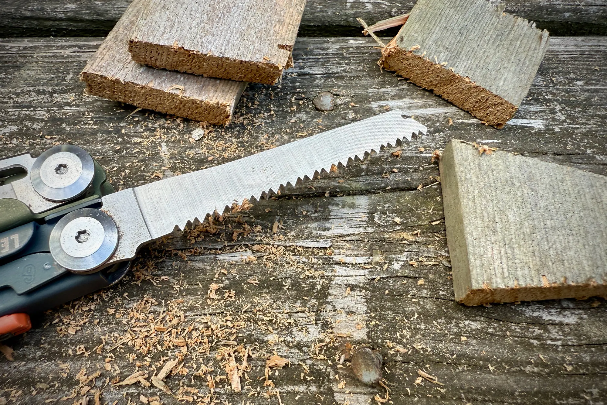 Leatherman Signal saw cutting through wood