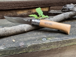Opinel No.08 knife on stick and rock