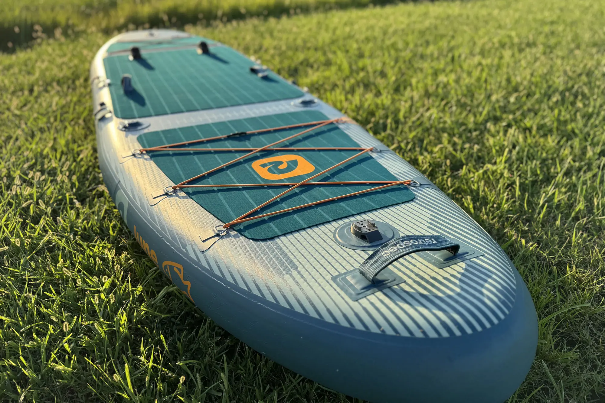 Retrospec June Inflatable SUP in the grass