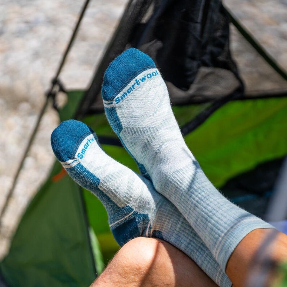 Close up of person wearing gray and blue socks