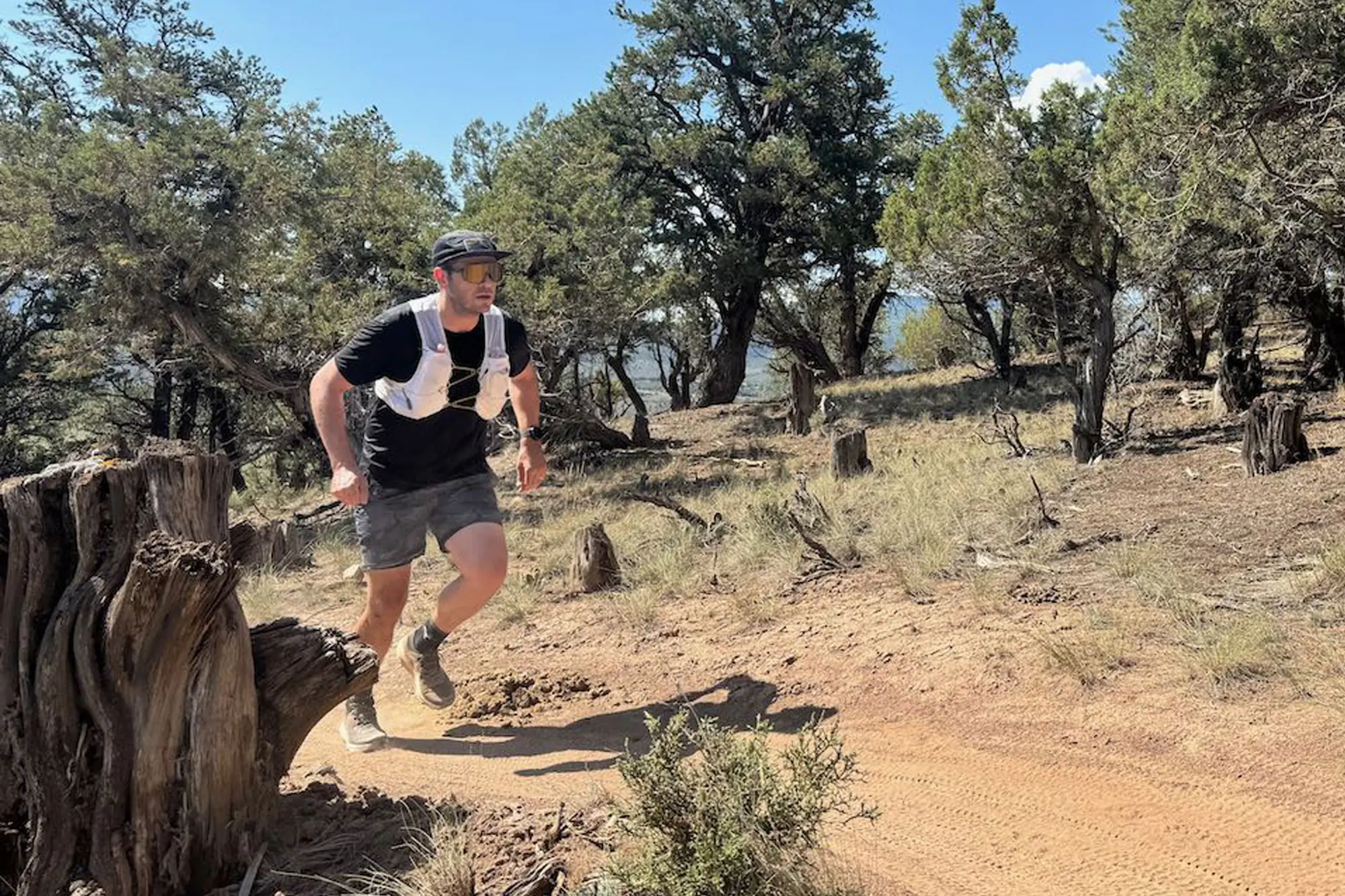 running and wearing The North Face Summit Series Run Vest 5