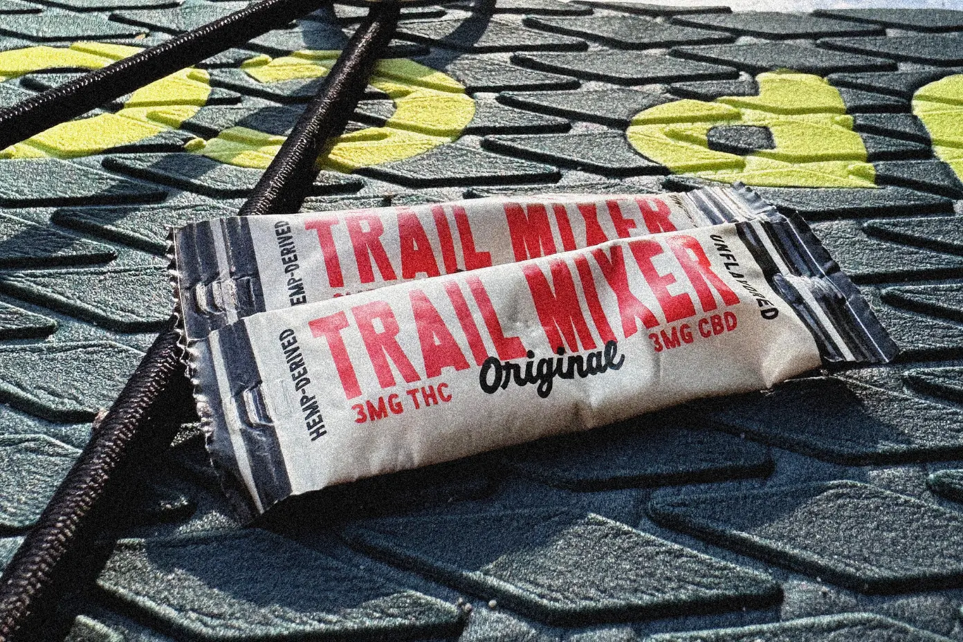 Close up of drink mix packets on a paddleboard