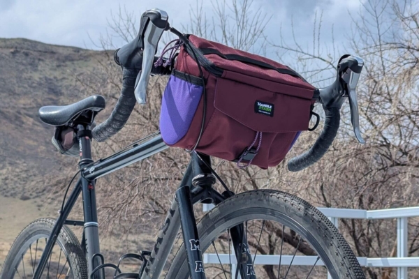 Bike with square red bag attached to handlebars