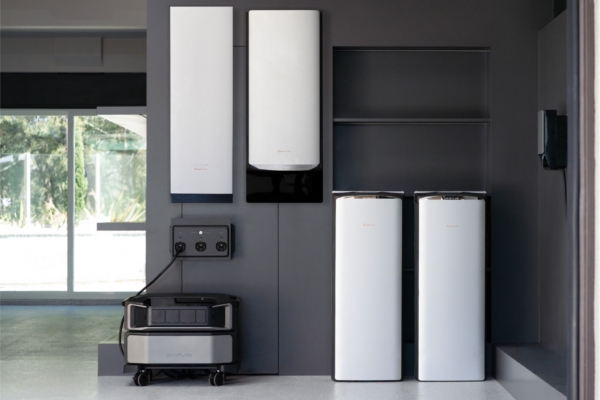 Garage with home generator and backup battery set up on walls 