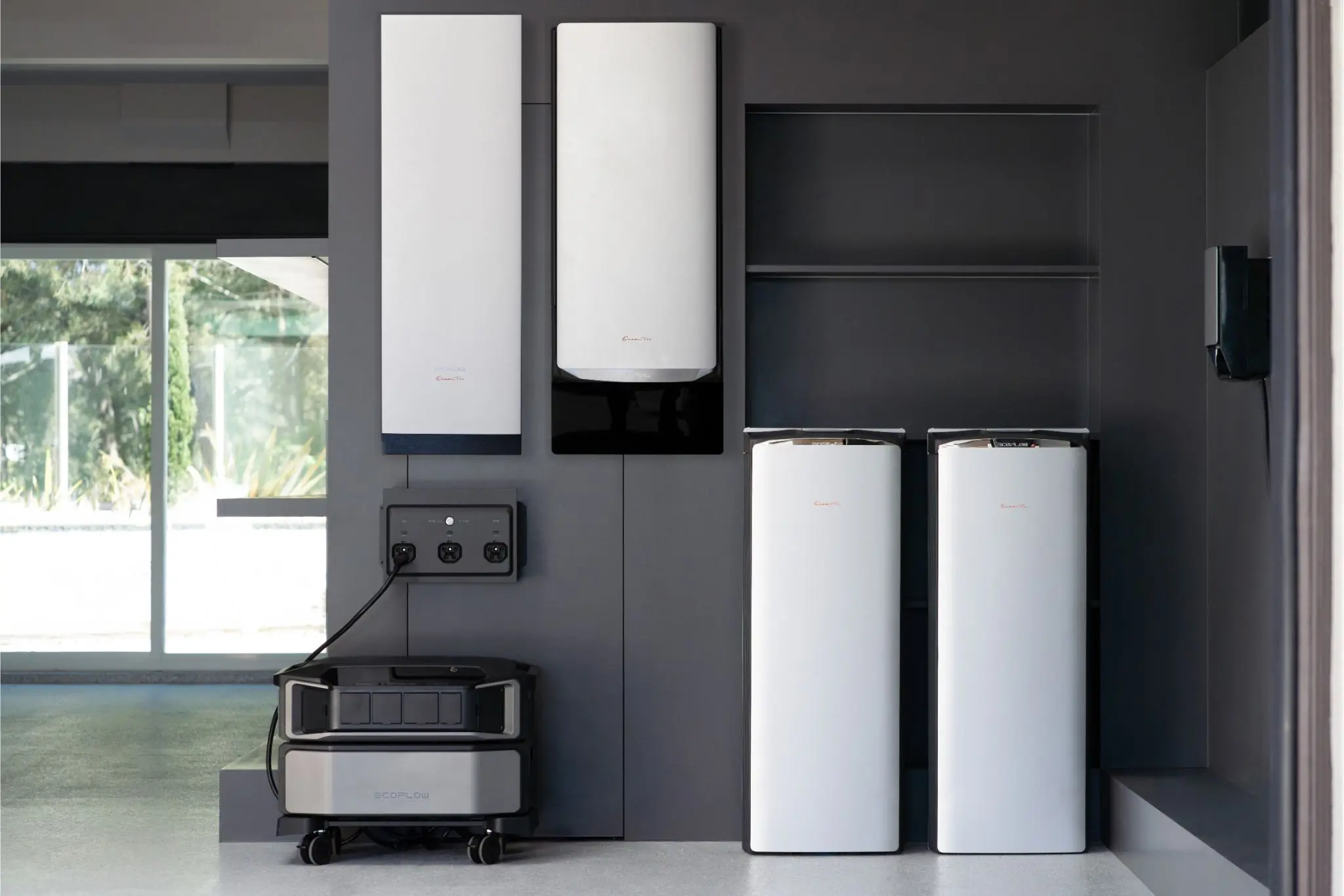 Garage with home generator and backup battery set up on walls 