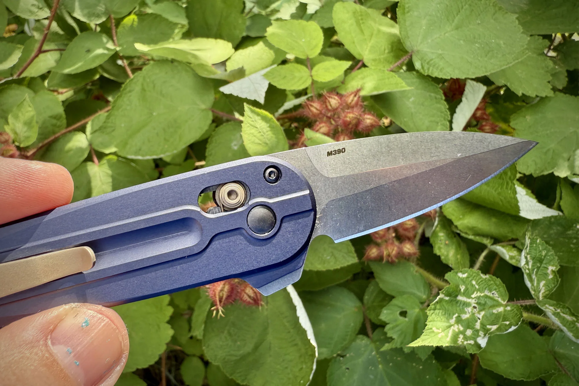 a man holding the Benchmade Lowden knife