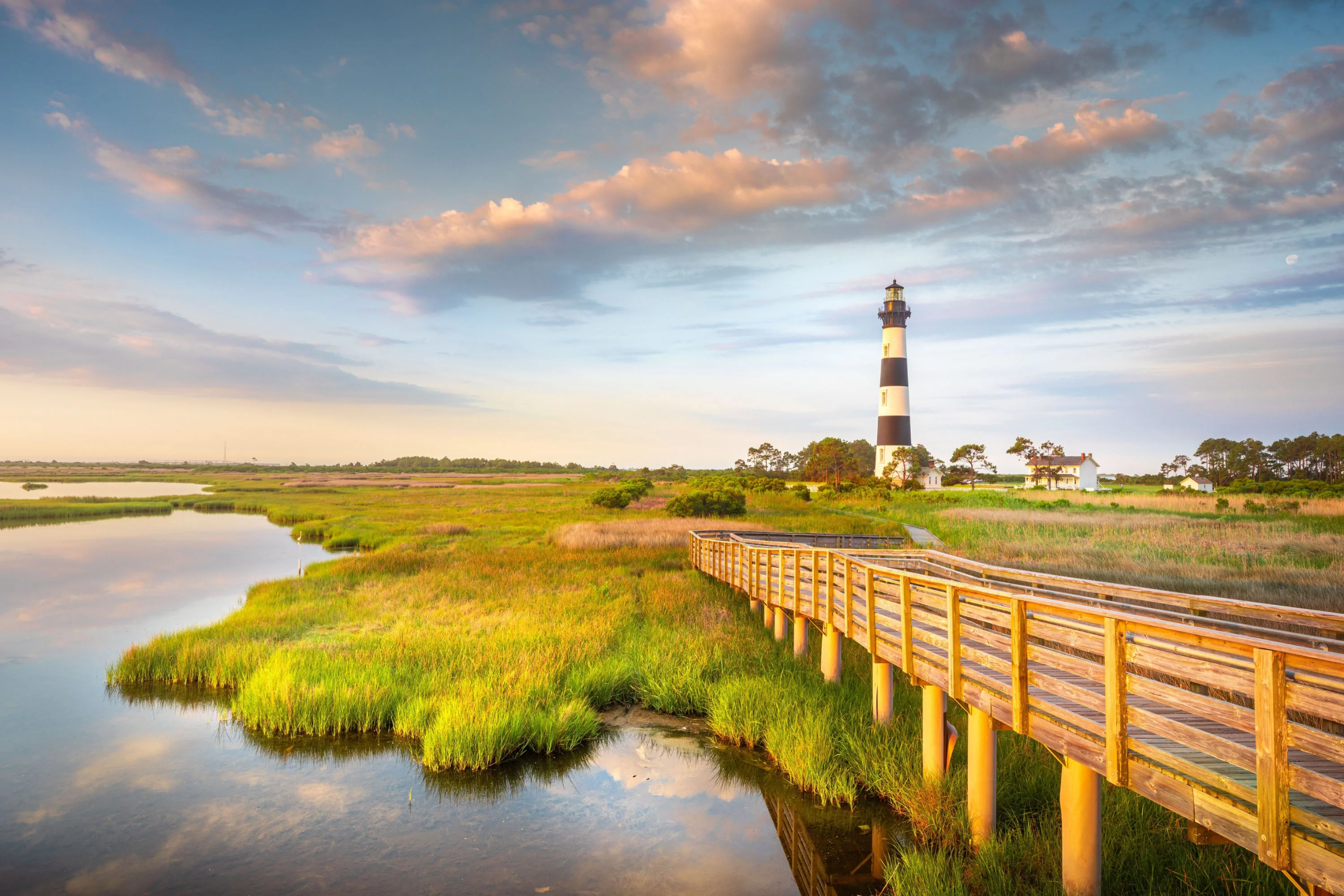 bridge and shoreline to lighthouse at cape hatteras national seashore