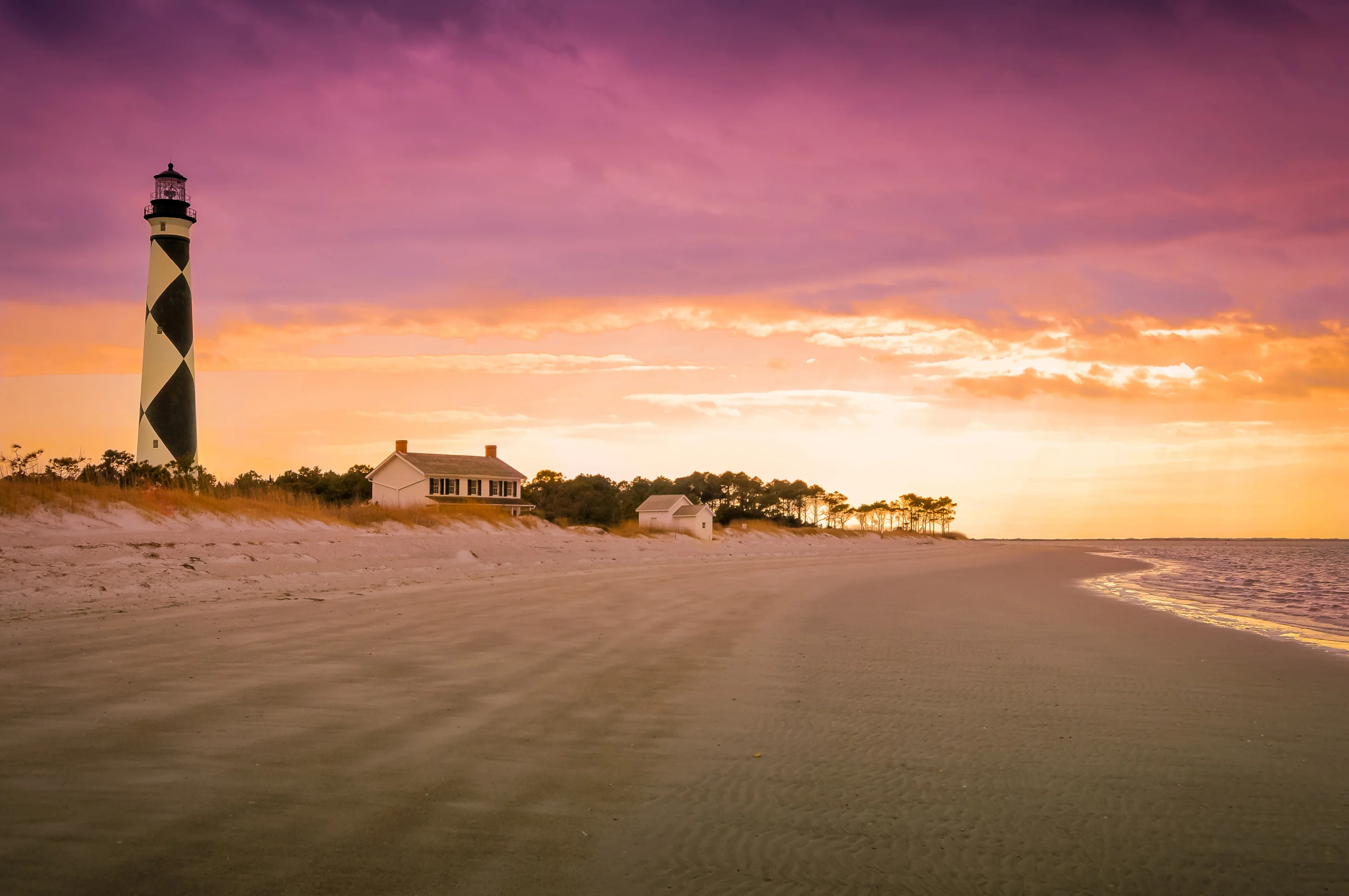 lighthouse at sunset in cape lookout national seahsore