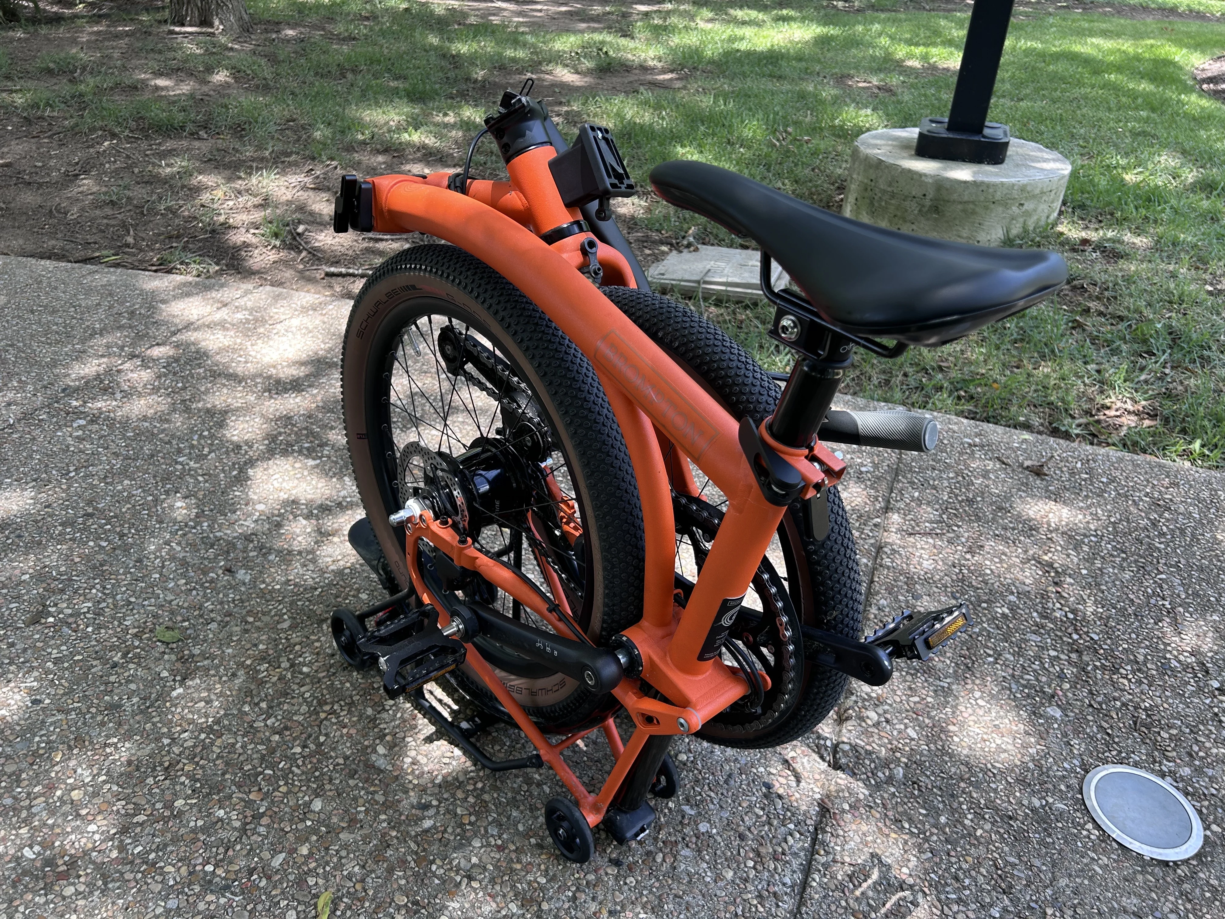 Brompton G-Line folding bike in a wooded area.