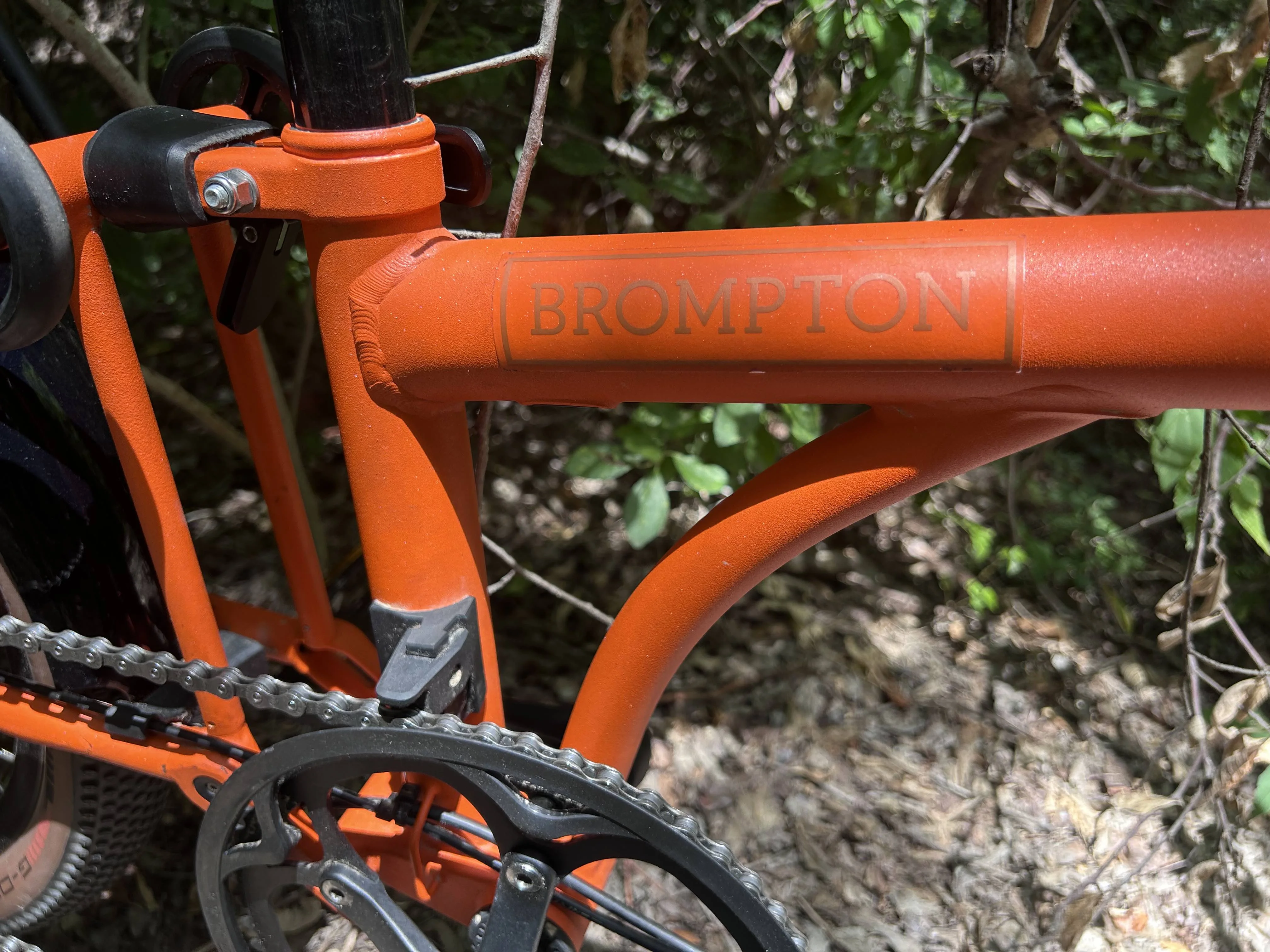 Brompton G-Line folding bike frame logo detail image.