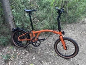 Brompton G-Line folding bike unfolded on a trail.