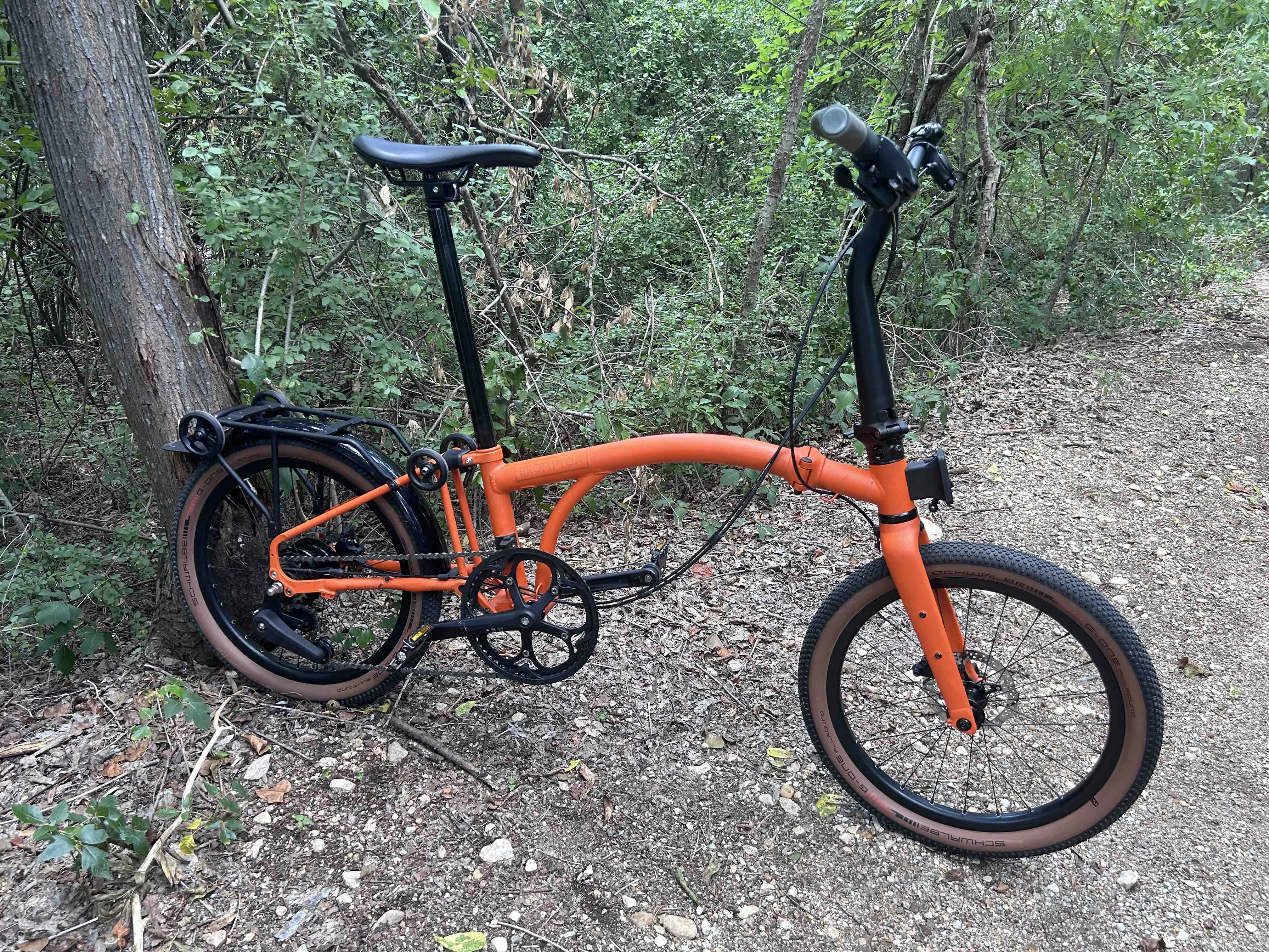 Brompton G-Line folding bike unfolded on a trail.