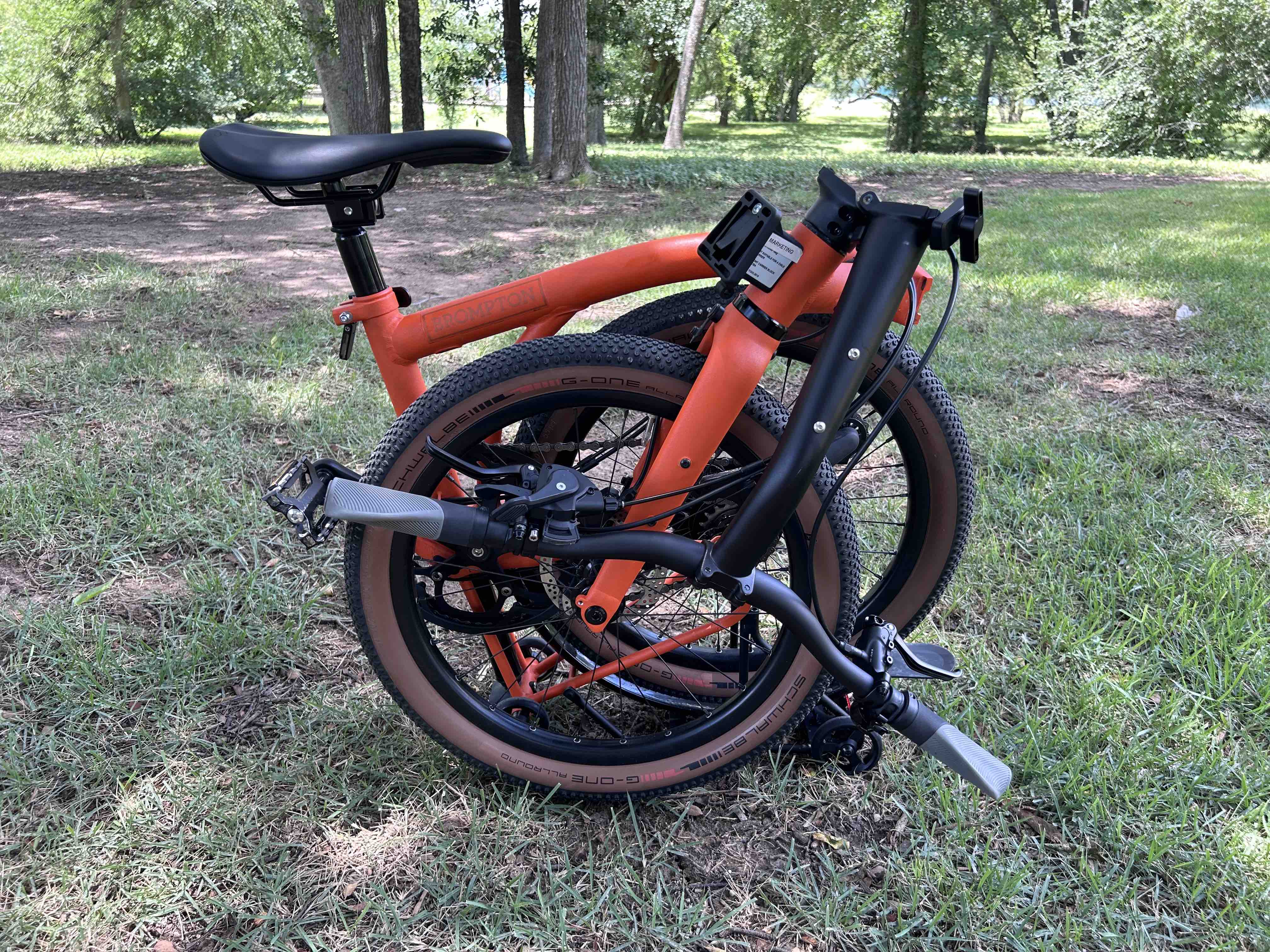 Brompton G-Line folded in a wooded area.