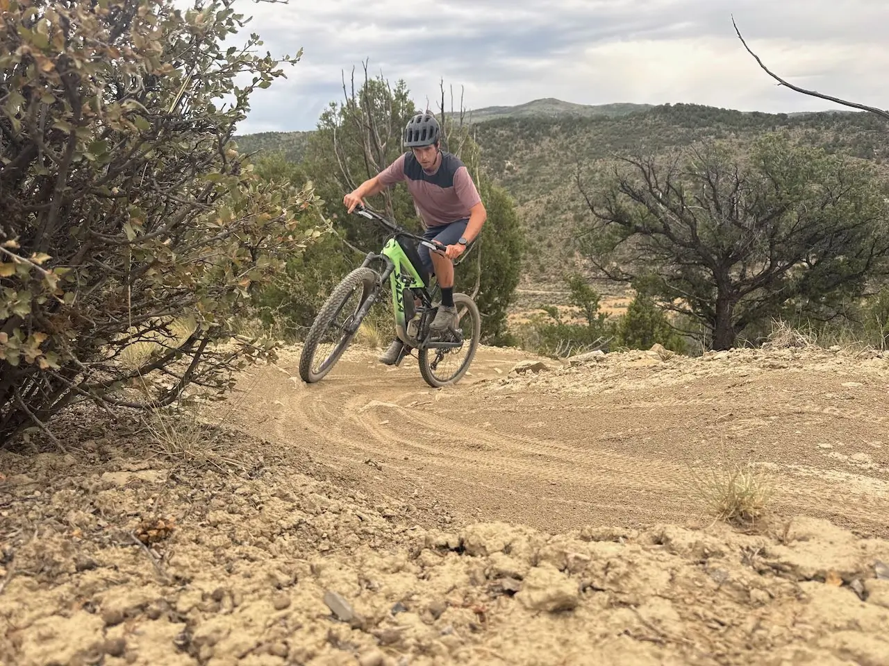 Rider leaning into a turn on the Salsa Blackthorn 125