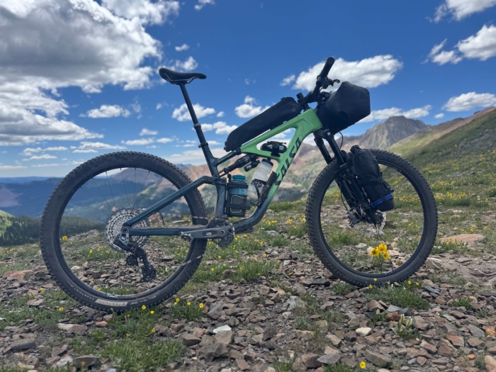 Fully loaded Salsa Blackthorn 125 overlooking a mountain range