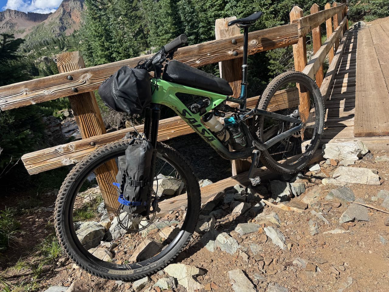 Salsa Blackthorn 125 on a wooden bridge over rocky terrain