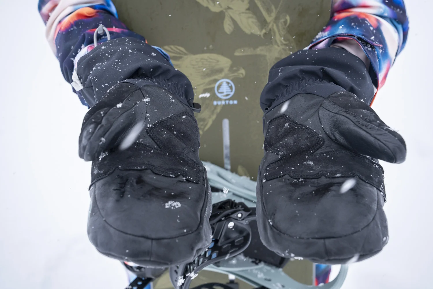 Close-up of a person wearing black Stio Objective Insulated Winter Mittens