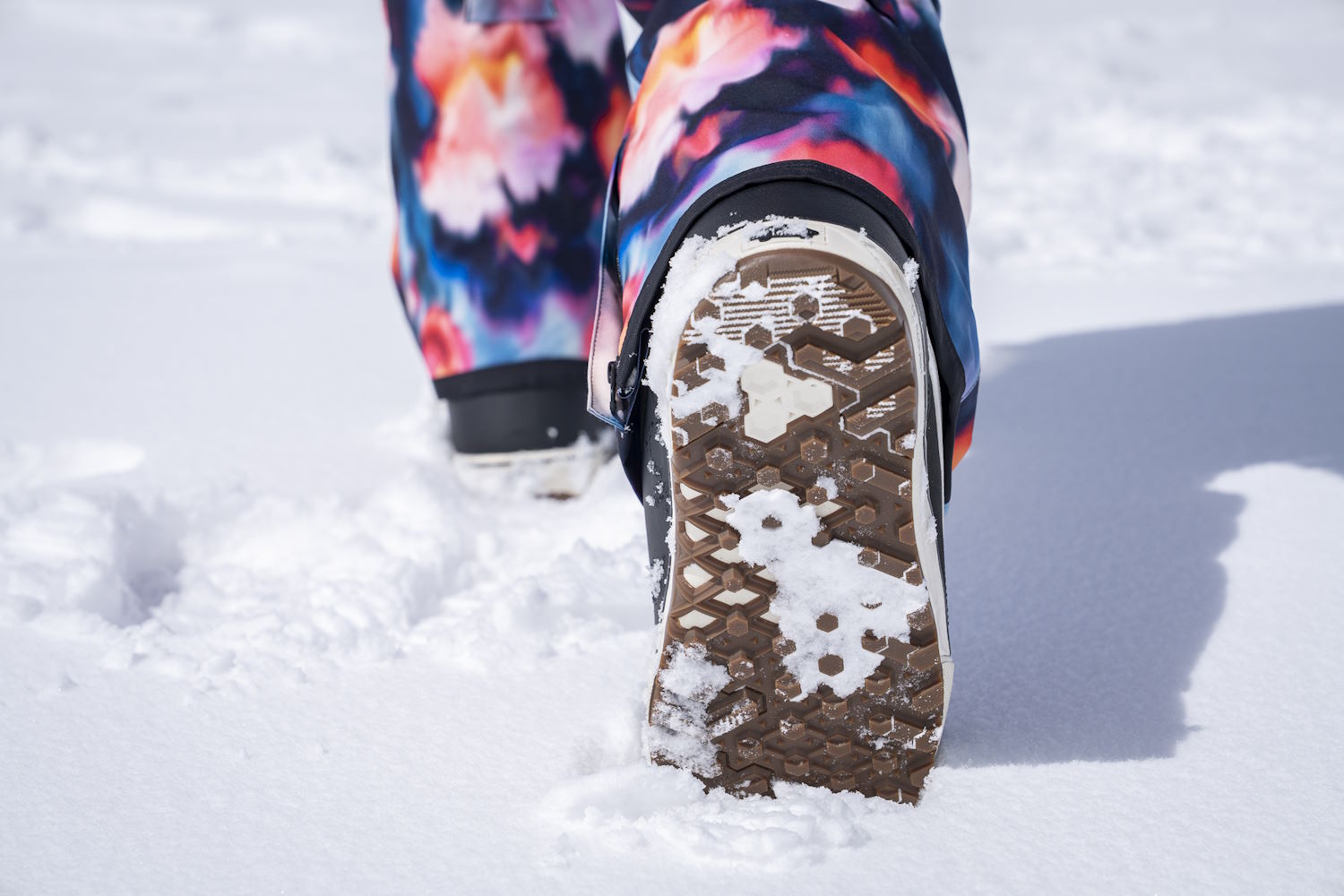 Close-up of Vans Women's Encore Pro Snowboard Boot sole making a footprint in fresh snow.