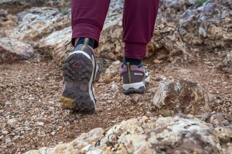 wearing the X Ultra 5 GTX on a rocky terrain