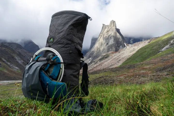 the unaweep pack unrolled in a high alaskan valley, with a pfd strapped to the front