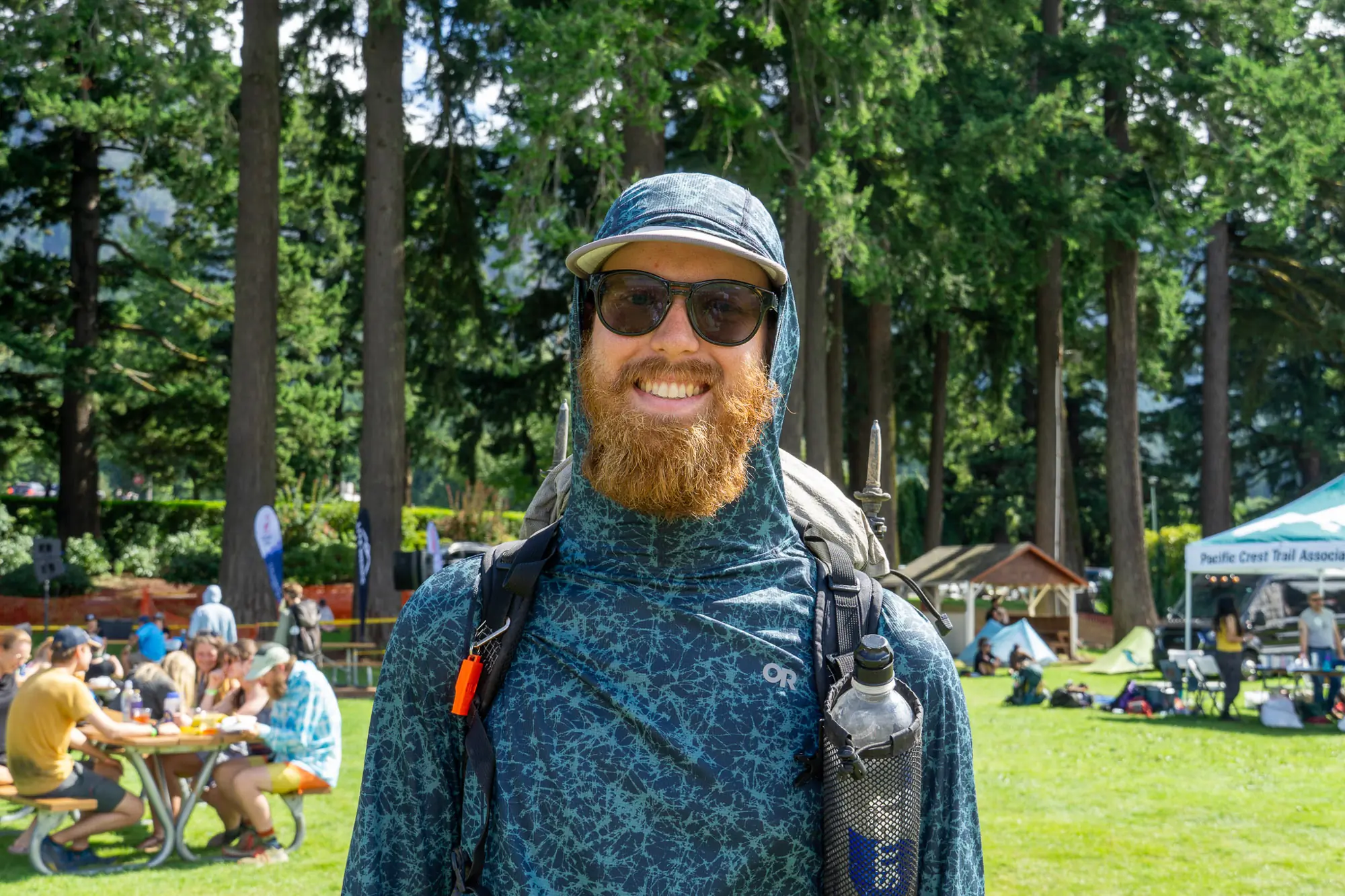 pct thru hiker scoutmaster poses at pct days 2025 while wearing his pack
