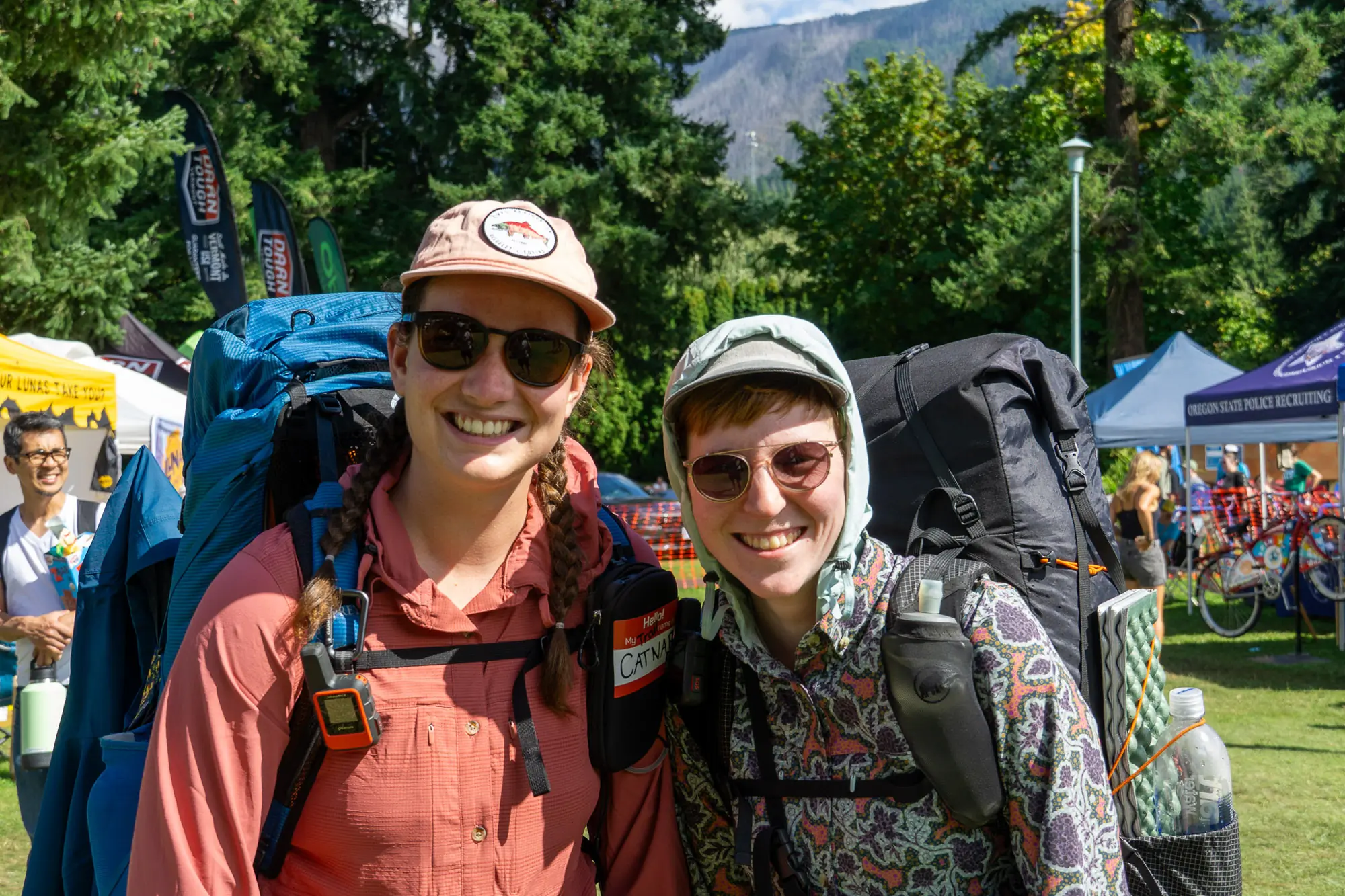 pct hikers catnap and birdie pose at pct days 2025 in their jolly gear triple crown button downs