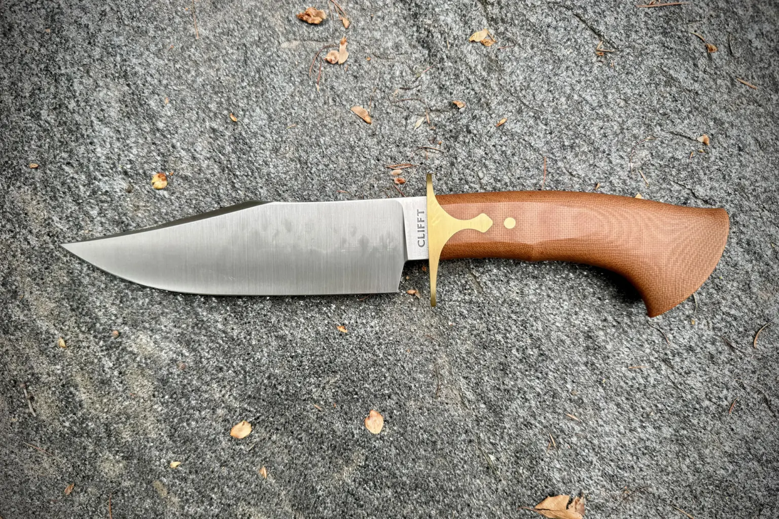 Dauntless Clifft Bowie Knife on geay surface
