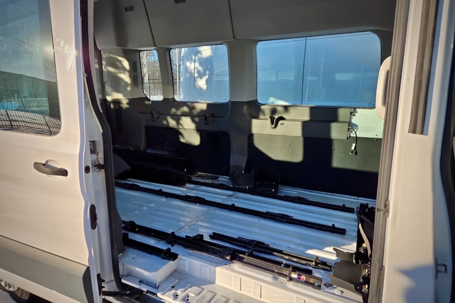 Interior of a Ford Transit Passenger van with seats removed
