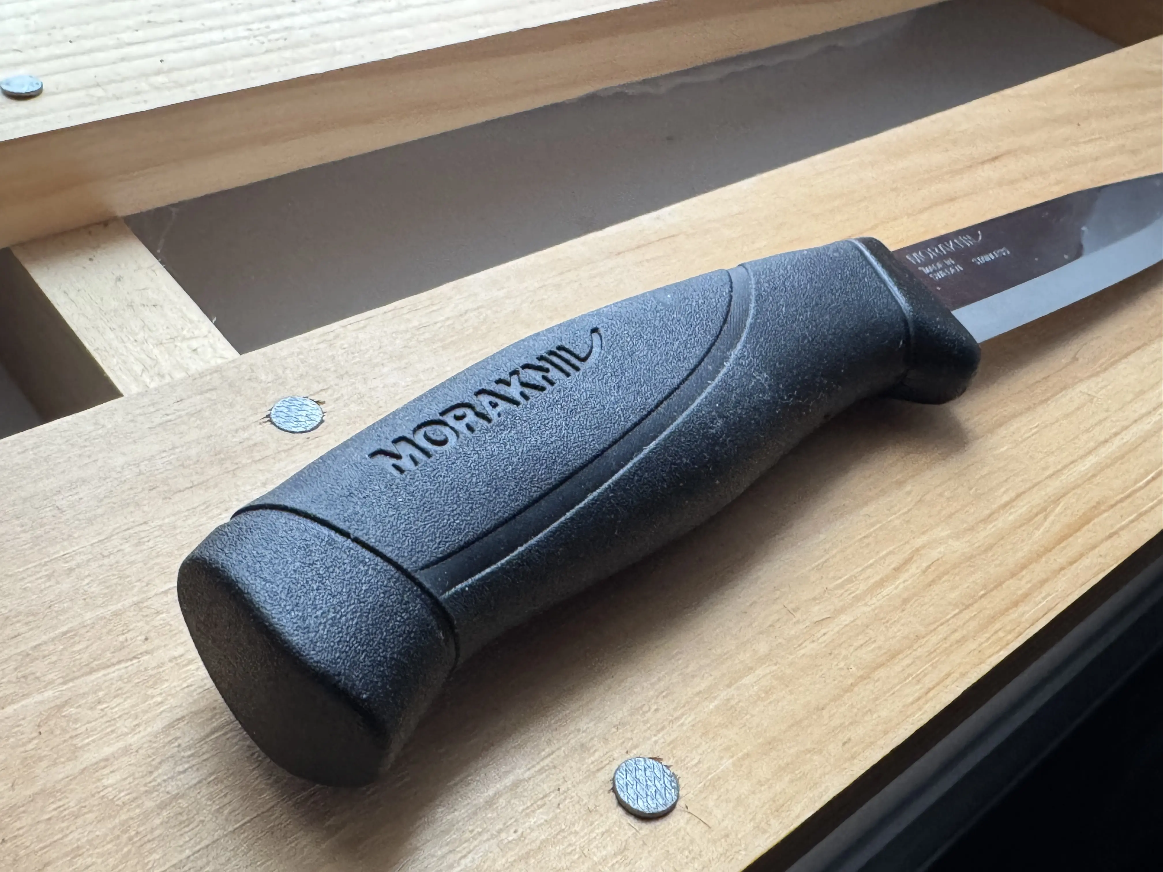 Morakniv Companion knife sitting on wood