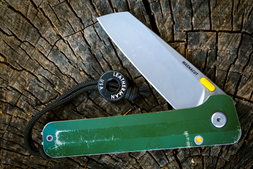 Leatherman Glider knife partially open on log