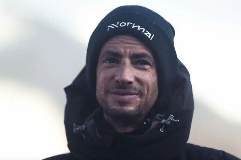 Portrait of Kilian Jornet wearing a parka and a beanie