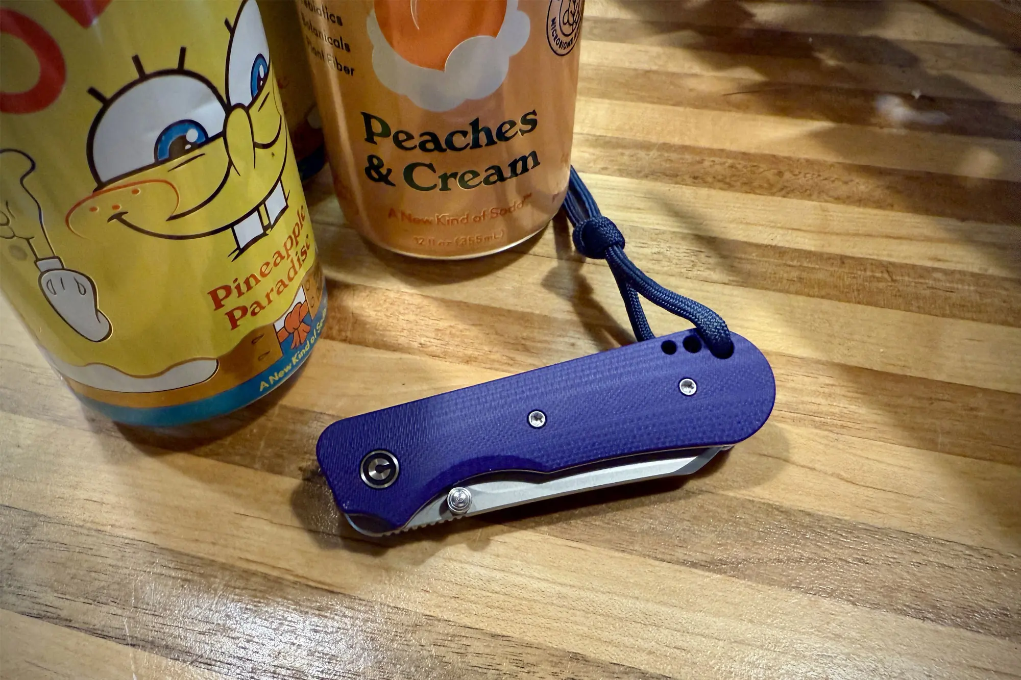 CIVIVI Crabby next to soda cans