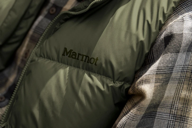 closeup of Marmot logo on puffy vest