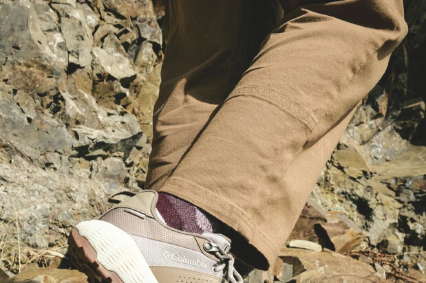 A detail image of a person wearing the Columbia ROC tech chino pants.