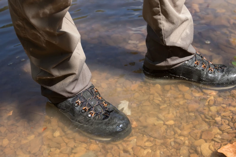 The Badlands Andaire pants wet in a creek.