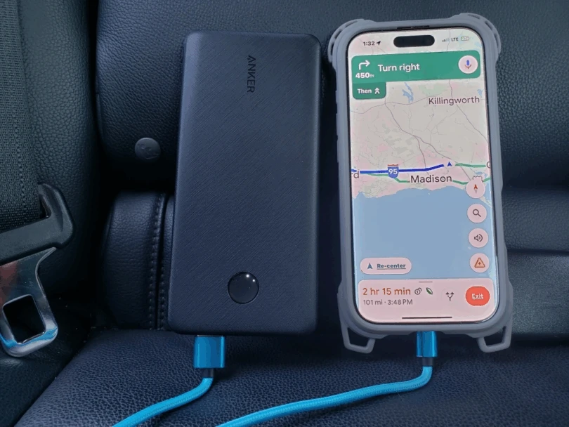 Anker 313 Power Bank charging a phone with navigation on the screen