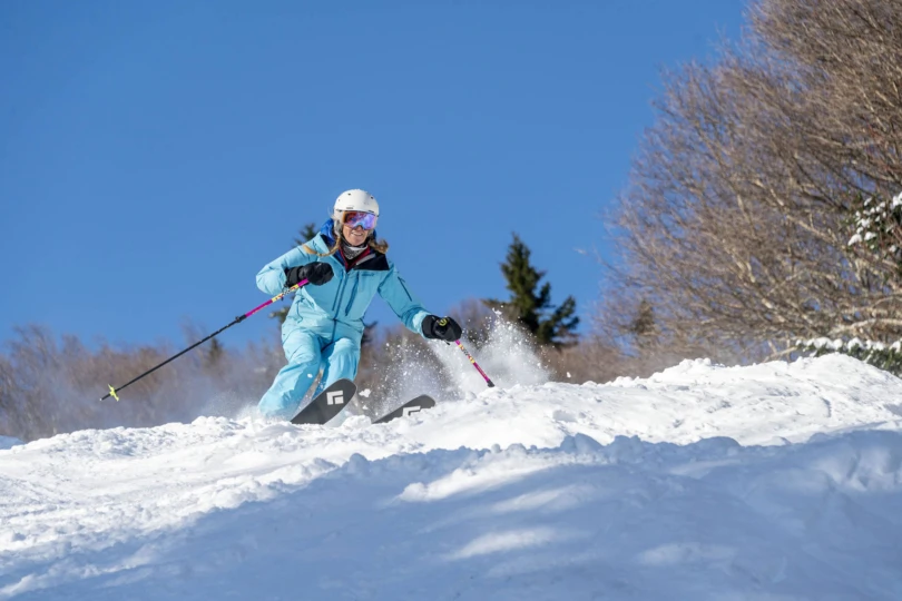 a skiier in Black Diamond Impulse Ti 104 W 