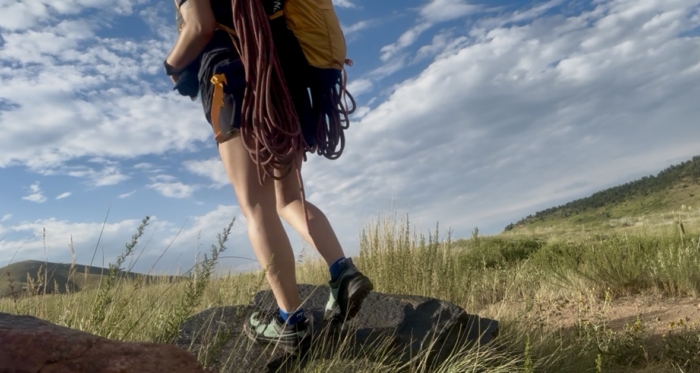 Black Diamond Technician Pro Approach Shoe with climbing rope carried on grassy terrain