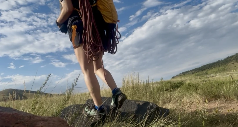 Black Diamond Technician Pro Approach Shoe with climbing rope carried on grassy terrain
