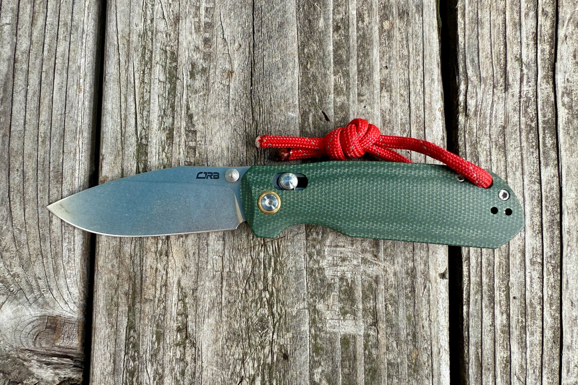 CJRB Maximal open on a wooden surface